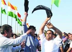 Some people show black flags during the Vikas Rally by Delhi Chief Minister Sheila Dikshit at Mohan Garden in New Delhi on Sunday
