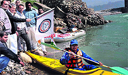 Union Minister for Water Resources Harish Rawat flags off a Haridwar to Benaras kayaking expedition in Haridwar on Sunday