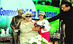 Governor Aziz Qureshi presents an award to Fatima Rizvi at the prize distribution ceremony of Sara Governors Golf Cup Tournament in Dehradun on Sunday