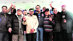 The winning panel of Rajat Agarwal shows a victory sign during the traders election in Mussoorie on Sunday