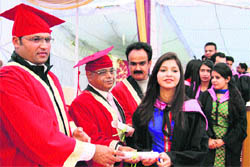 Sirsa MP Ashok Tanwar gives away degrees at the convocation of Manohar Memorial Postgraduate College in Fatehabad on Sunday.