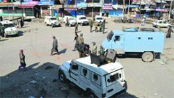 Security personnel patrol an area in Pulwama as demonstrators protest in the wake of death of Mudassir Kamran of Pulwama, who was pursuing PhD in English and Foreign Languages University, Hyderabad, on Sunday.