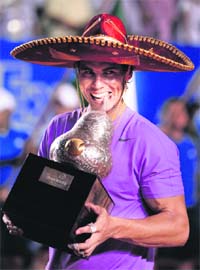 Spains Rafael Nadal in Mexican colours after defeating David Ferrer in the final at the Acapulco International tournament in Acapulco