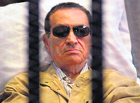 A file photo of ousted Egyptian President Hosni Mubarak sitting inside a courtroom in Cairo.