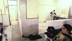 Patients have no option but to use water from taps adjoining toilets at the new OPD Block of the PGI. Tribune photo: Pradeep Tewari