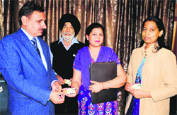The RLA, Mahavir Kaushik, gives a drivers licence to an applicant at the RLA office in Sector 17 in Chandigarh on Monday. tribune photo: s Chandan
