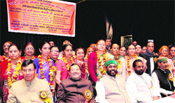 Primary Education Minister Mantri Prasad Naithani (third from left) with primary teachers at a farewell function in Dehradun on Monday. Tribune photo: Vinod Pundir 
