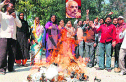 Congress activists stage a protest against the remarks of Narendra Modi (inset), at the district collector camp office in Haridwar on Monday. Tribune photo: Rameshwar Gaur