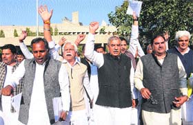 INLD legislators protest outside the Haryana Vidhan Sabha in Chandigarh on Monday