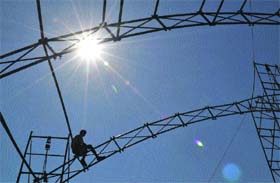 Height of faith: A labourer at work ahead of the Shivratri fair in Mandi on Monday