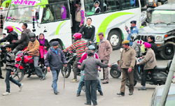 Traffic policemen try to regulate movement of vehicles in jammu on Monday. Tribune photo: Inderjeet Singh
