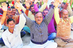 Members of National Mazdoor Conference protest in Jammu on Monday. A Tribune photo