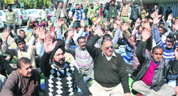 Members of Provincial Power Employees Union stage a protest in Jammu on Monday. Tribune photo: Inderjeet Singh