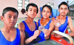 The gymnasts with their medals in Ludhiana.