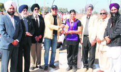 The management of Sri Ram College, Dalla, Jagraon, felicitates an athlete during the annual athletics meet.