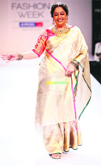 Kirron Kher walks the ramp for Gaurang Shah
