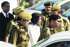 Social activist Irom Sharmila being led out of the Patiala House court in Delhi on Monday. 