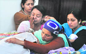 Wailing relatives of a child at Mudda village.