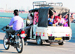 Ignoring safety norms, an overloaded auto ferry schoolchildren in Amritsar on Tuesday