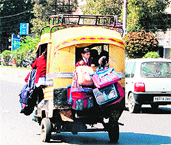 Ignoring safety norms, an overloaded auto and a school van ferry schoolchildren in Amritsar on Tuesday