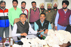 IG (Counter Intelligence) Jatinder Jain (left) along with AIG Ajay Maluja addresses mediapersons following the seizure of heroin and weapons, in Bathinda on Tuesday.