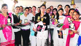 Prized possession: Girls in a jubilant mood after the annual prize distribution function at the Dev Samaj College for Women, Sector 45, Chandigarh, on Tuesday
