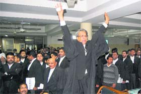 Advocates of the Punjab and Haryana High Court hold a protest in Chandigarh on Tuesday