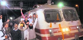A stop at Mohali, at last: People in a jubilant mood as the Chandigarh-Amritsar Superfast Express makes its maiden halt at the Mohali railway station on Tuesday