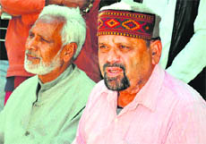 Trivendra Singh Panwar, president of the Uttarakhand Kranti Dal, addresses a press conference in Dehradun on Tuesday.