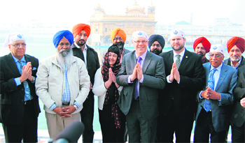 Members of the delegation led by Greg Selinger (fourth from left), Premier of Manitoba, at the Golden Temple in Amritsar. Tribune photos
