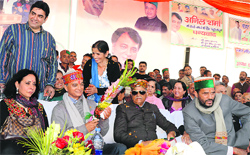 Rural Development Minister Anil Sharma with wife Sunita, father Sukh Ram and District Congress chief Puran Chand in Mandi on Tuesday. Photo: Jai Kumar
