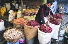 A vendor sells Kashmiri red chillies in Srinagar on Tuesday