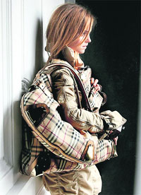 mma Watson carrying a Burberry bag