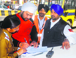 A day after the accident, police officials challan a school bus for overloading students in Jalandhar on Tuesday.