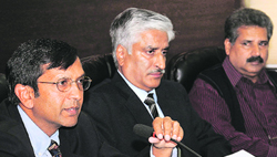 State DGP Sumedh Saini with Dinkar Gupta, ADGP (left) and Hardeep Dhillon, ADGP, Intelligence, in Chandigarh on Tuesday.