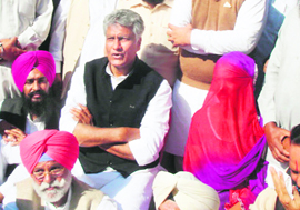 CLP Leader Sunil Jakhar with the victim at Usma village on Tuesday.