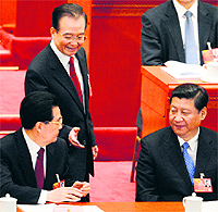 Chinese Premier Wen Jiabao (C) with President Hu Jintao (L) and Vice-President Xi Jinping at the opening session of the National People's Congress in Beijing on Tuesday