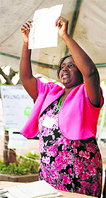 A poll official shows a ballot during the counting operation in western Kenya on Monday