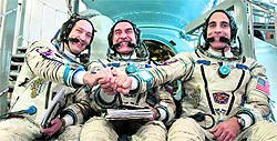Members of the next expedition to the International Space Station (ISS) Russian cosmonauts Alexander Misurkin (L) and Pavel Vinogradov (C), and US astronaut Christopher Cassidy before their final preflight examination in Russia on Tuesday. The trio is scheduled to blast off to the ISS on March 28