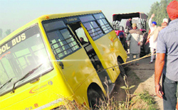 A school bus carrying 20 kids turned turtle near Jhoke Mohre village in Ferozepur district on Wednesday. A Tribune photograph