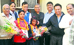 Neighbours congratulate Ishika on her success in the Asian Martial Arts Championship, at Sector 10 in Panchkula