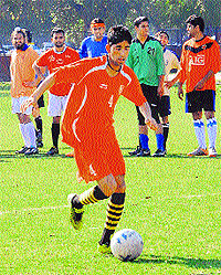 Players in action during the football trials at Sector 17, Chandigarh
