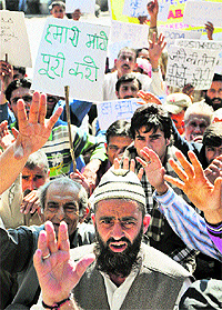 Activists of the Erstwhile Doda Migrants Committee protest in Jammu on Wednesday