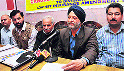Members of Life Insurance Agents Federation of India J&K address mediapersons in Jammu on Wednesday
