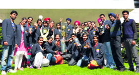 Students of Guru Angad Dev Veterinary and Animal Sciences University display the runners-up trophy won at the 13th All-India State Agricultural University Youth Festival.