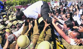 Raising an Issue: Police in action against advocates protesting in support of their demands outside the Rajasthan Assembly during the budget presentation, in Jaipur on Wednesday