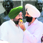 PPCC chiefs brother Fatehjang (left), who was an Amarinder loyalist, celebrates his brothers elevation in Chandigarh on Wednesday. 