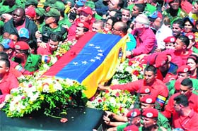 Supporters with the coffin of Venezuelan President Hugo Chavez in Caracas on Wednesday