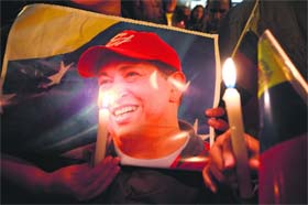 Supporters of Venezuelan President Hugo Chavez pay tributes to the leader on Tuesday