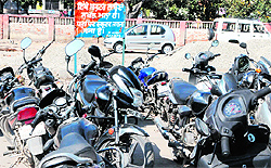 Vehicles parked in a parking zone at Amritsar railway station on Thursday. Such violations can be seen in different parts of the city with least regard to norms